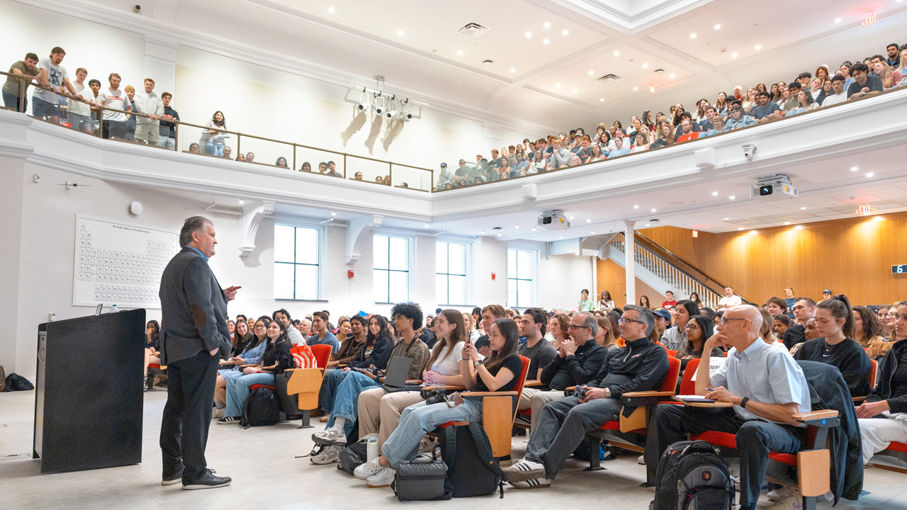 Head Hockey Coach Mike Schafer speaks to a crowded auditorium in Baker Hall as his “Last Lecture” on Wednesday, April 23, 2025. (Ryan Young / Cornell University)