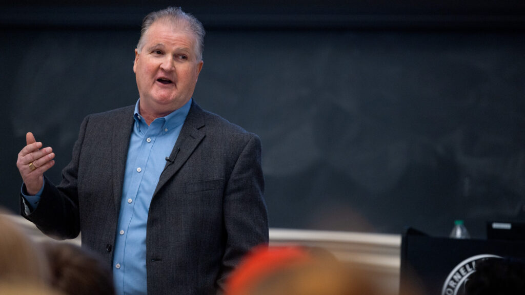 Head Hockey Coach Mike Schafer speaks to a crowded auditorium in Baker Hall as his “Last Lecture” on Wednesday, April 23, 2025. (Ryan Young / Cornell University)