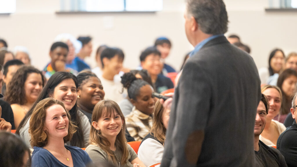 Head Hockey Coach Mike Schafer speaks to a crowded auditorium in Baker Hall as his “Last Lecture” on Wednesday, April 23, 2025. (Ryan Young / Cornell University)