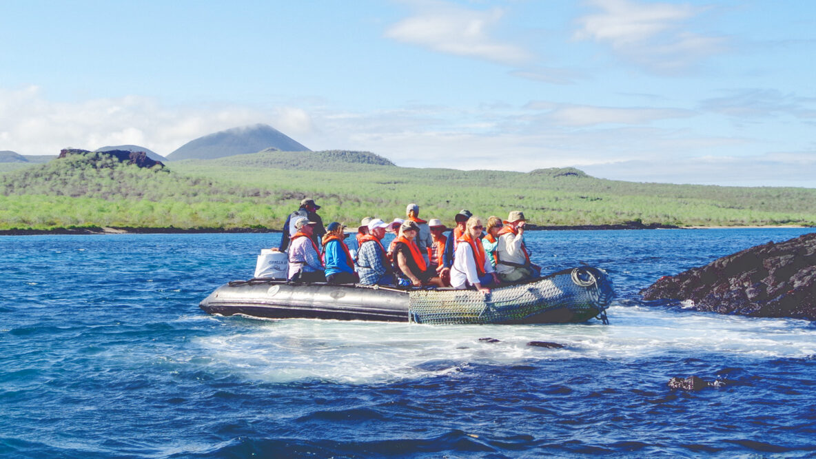 A group of tourists on an inflatable boat in the Galapagos Islands