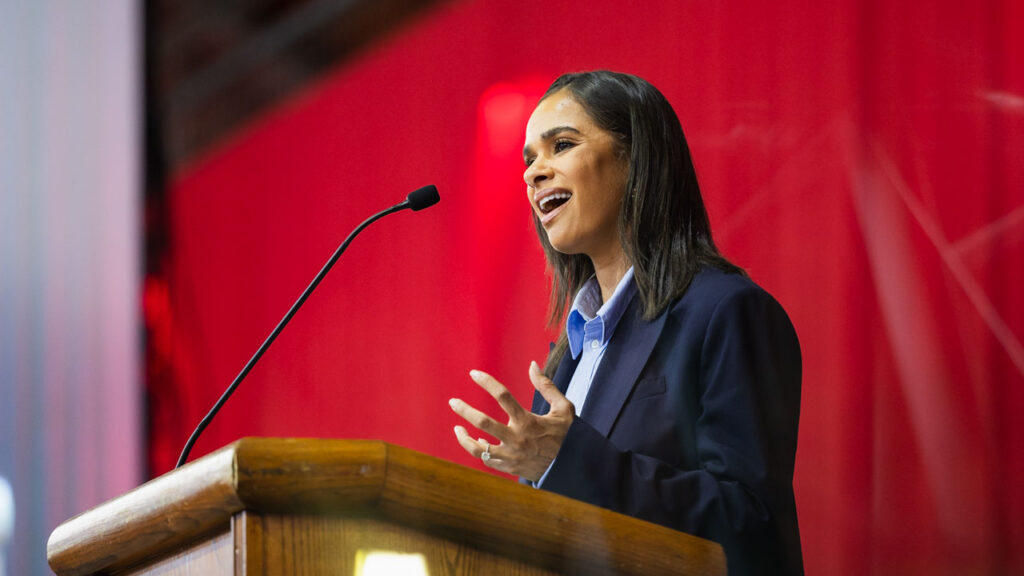 Misty Copeland, first Black woman to be named principal dancer of the American Ballet Theatre, speaks into a microphone while delivering the senior convocation address in Barton Hall.