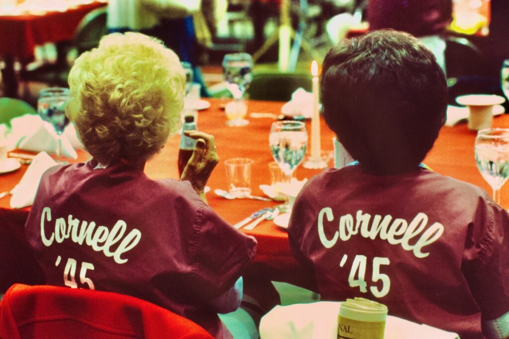 two members of the Class of 1945 at a table in Barton Hall during Reunion 1985
