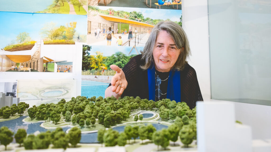 Susan Rodriguez describes features of the Harlem Meer project on an architectural scale model at her studio in the Chelsea neighborhood of Manhattan