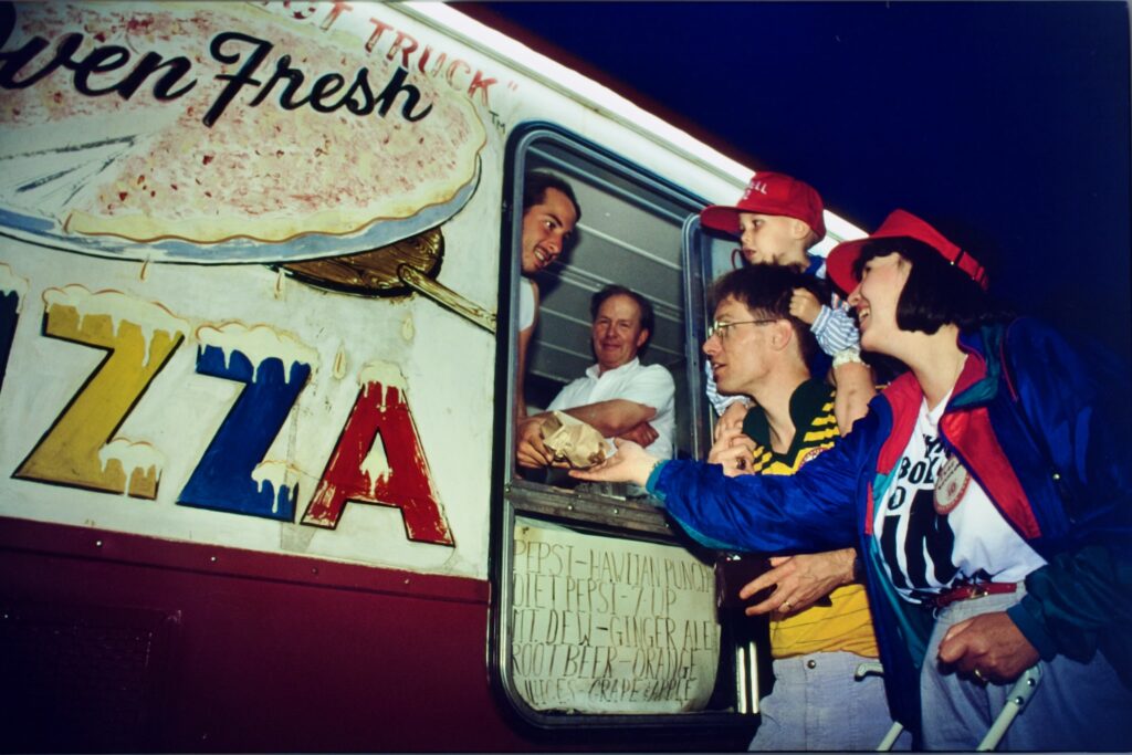 Bob Petrillose and a staffer at the famed Hot Truck serve French bread pizza subs at Reunion 1992
