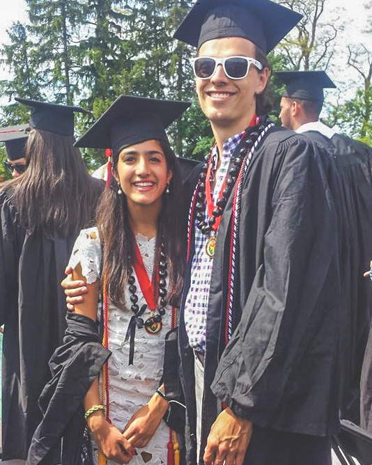 Quinn Cox and Lilia Karimi in their gap and gowns during commencement.