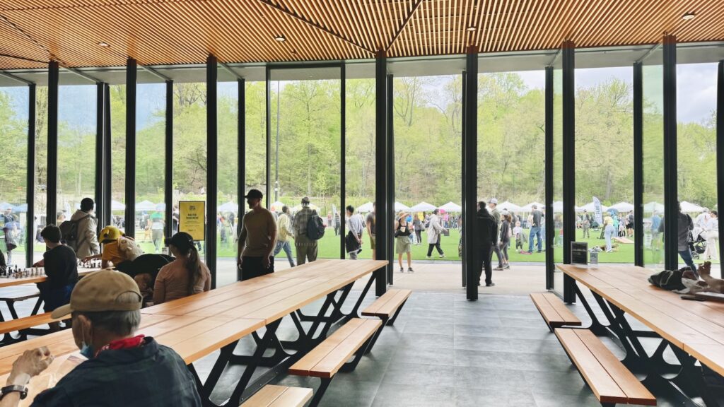 View from the new center pavilion, looking out the glass doors onto the turf