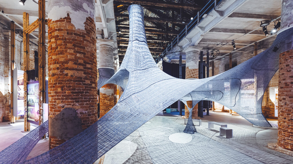 "Necto" depicts fiber panels stretched across brick columns