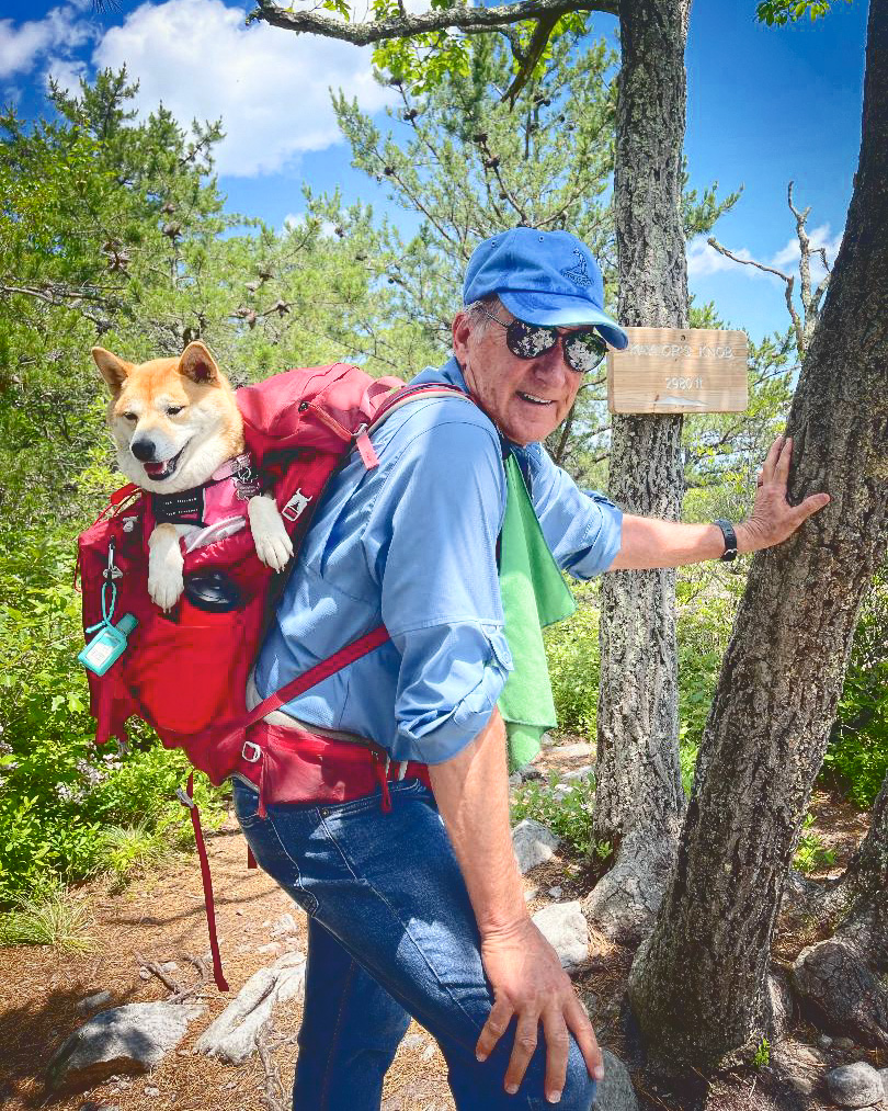 David Bowen hiking with his dog in a backpack