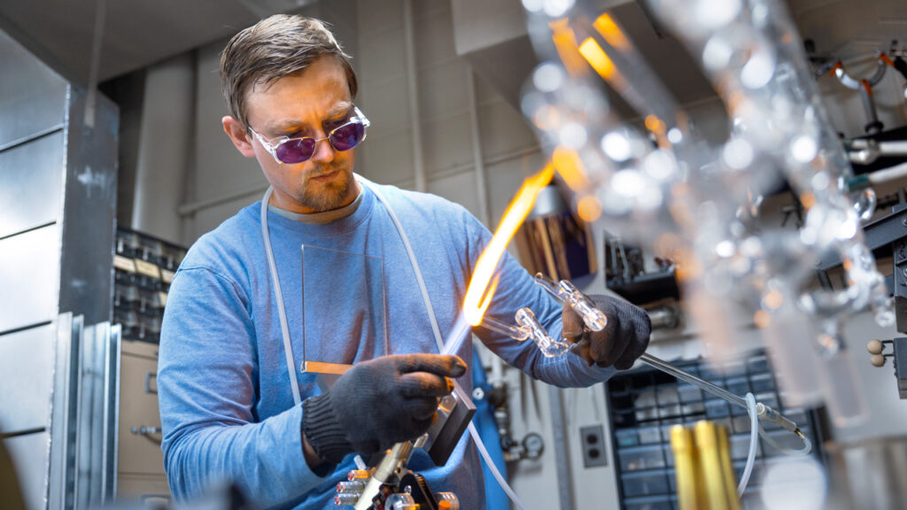 Sean Donlon, Scientific Glass Blower for Cornell, works on bespoke lab instruments in the Olin Glass Shop.