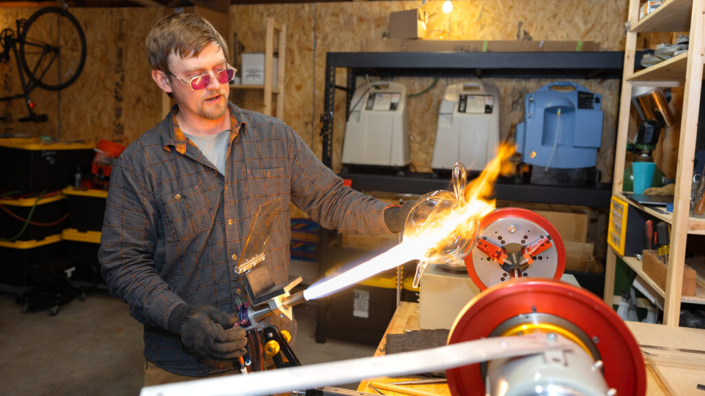 Sean Donlon, Scientific Glass Blower for Cornell, creates creates blobby, mirror teapots, cups and sugar bowls that have been featured in magazines and fine art museums. Location: Sean's personal studio near Ithaca, NY.