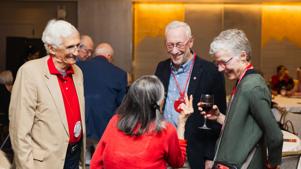 Michael Kotlikoff greets alumni at the Passing It Forward ceremony during Cornell Reunion in Statler Hall.