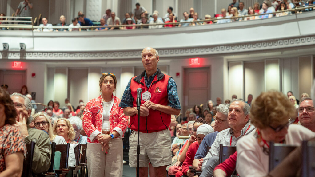 man asks a question during the State of the University Address