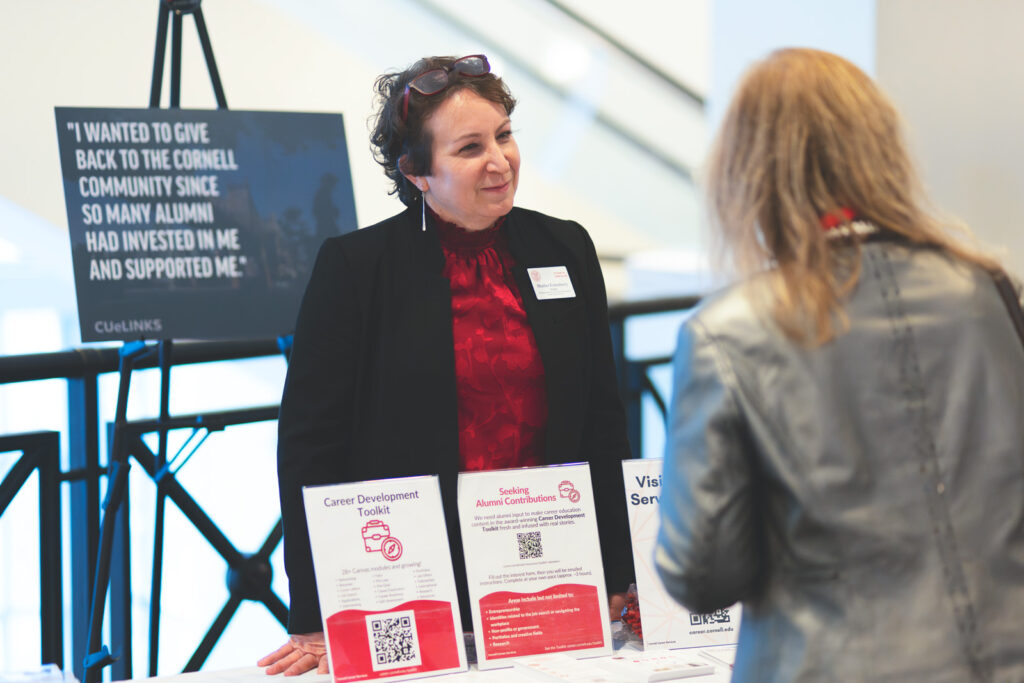 Heather Fortenberry speaks with an alumni about CUeLINKS at the Cornell Alumni Leadership Conference in February 2025.