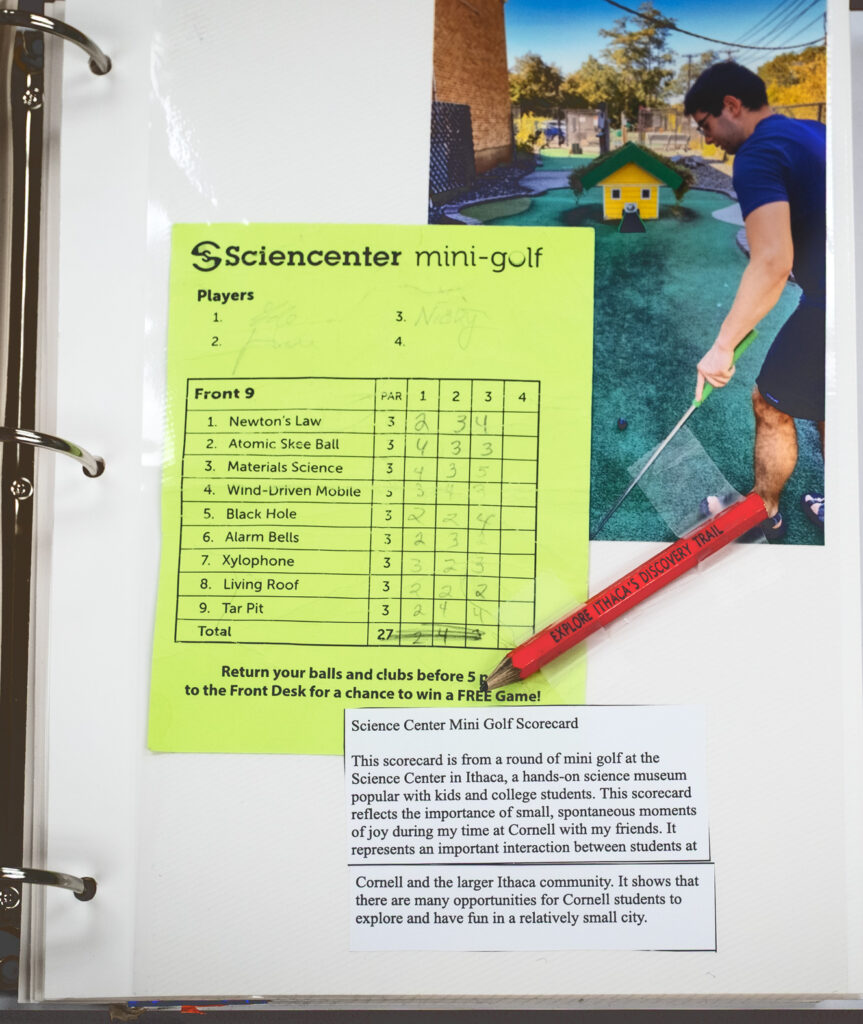 page of a student's scrapbook made for final project for AMST 2001 course showing a photo, scorecard, and the actual pencil from the local Sciencenter mini-golf activity