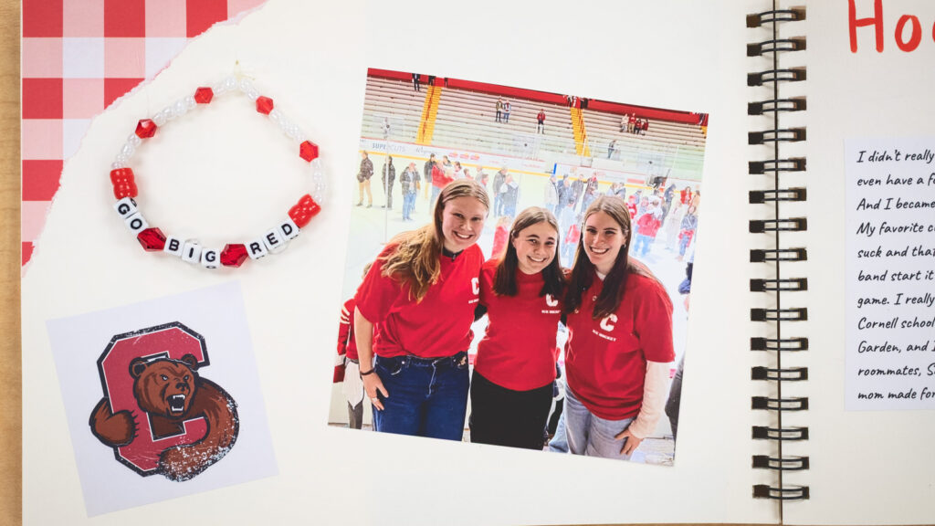 pages of a student's scrapbook made for final project for AMST 2001 course showing a "Go Big Red" bracelet, a photo of three women, and a Cornell Big Red sticker
