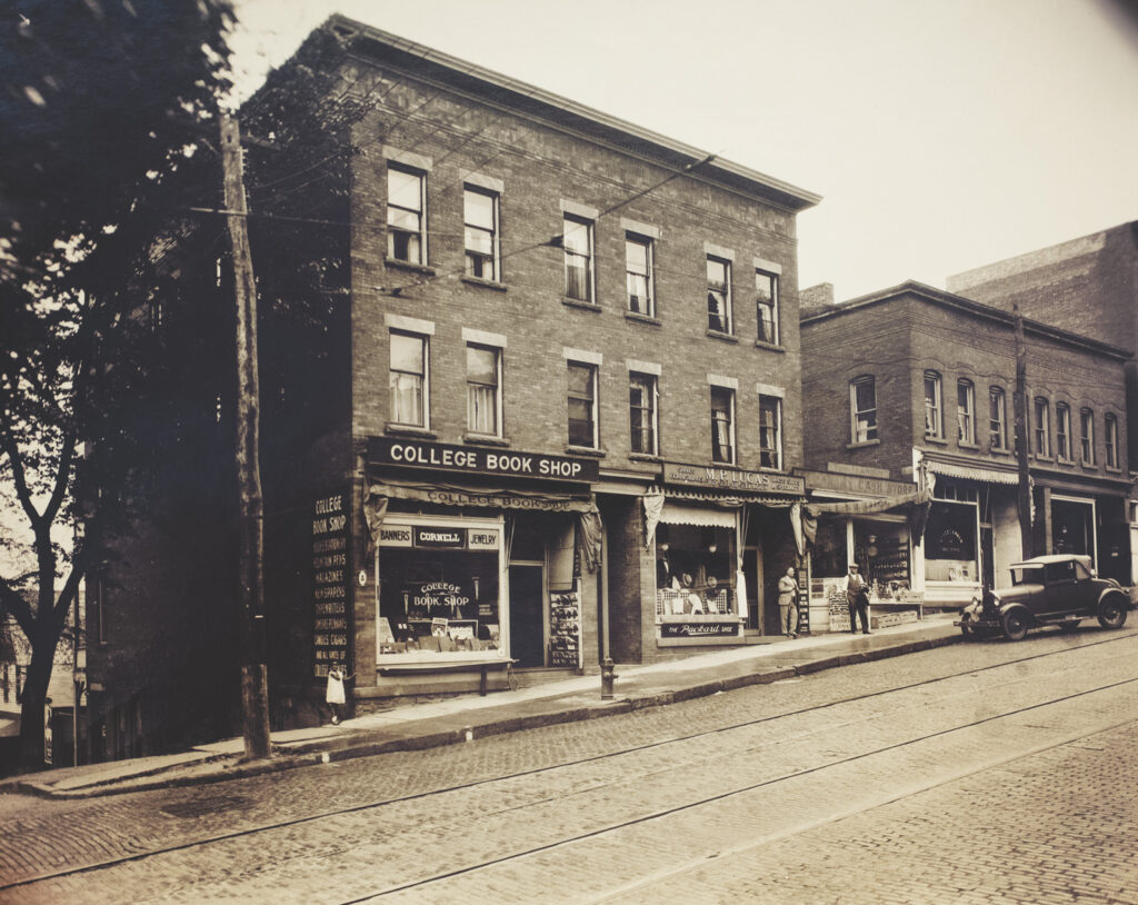 The College Book Shop and adjacent storefronts as they appeared along the west side of Eddy Street, 1928