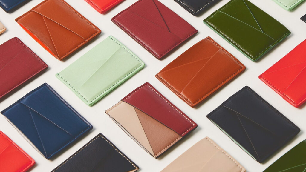 Cardholders from Allegorie made from apples in their "Puzzle" style in a variety of colors including mint and dark green, blue, orange, red, and tan.