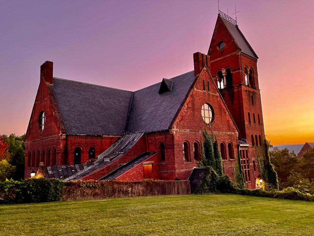 view of Barnes Hall during a sunset with a purple and yellow sky in the background