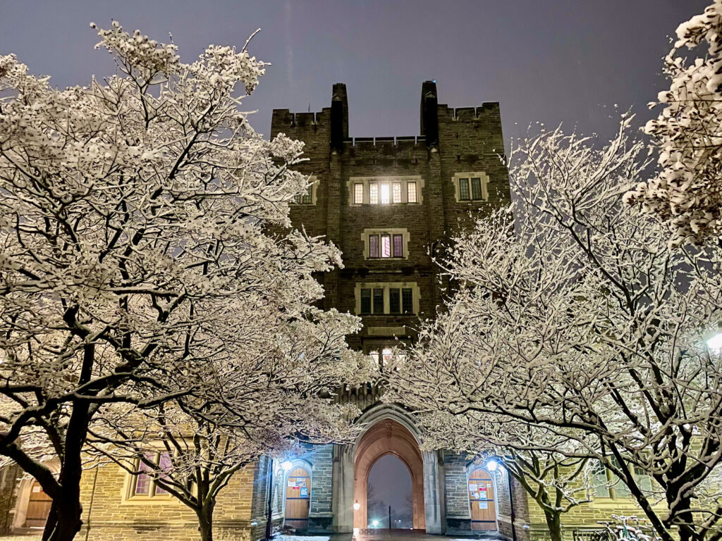 the War Memorial and entry to West Campus with snow covered trees in front
