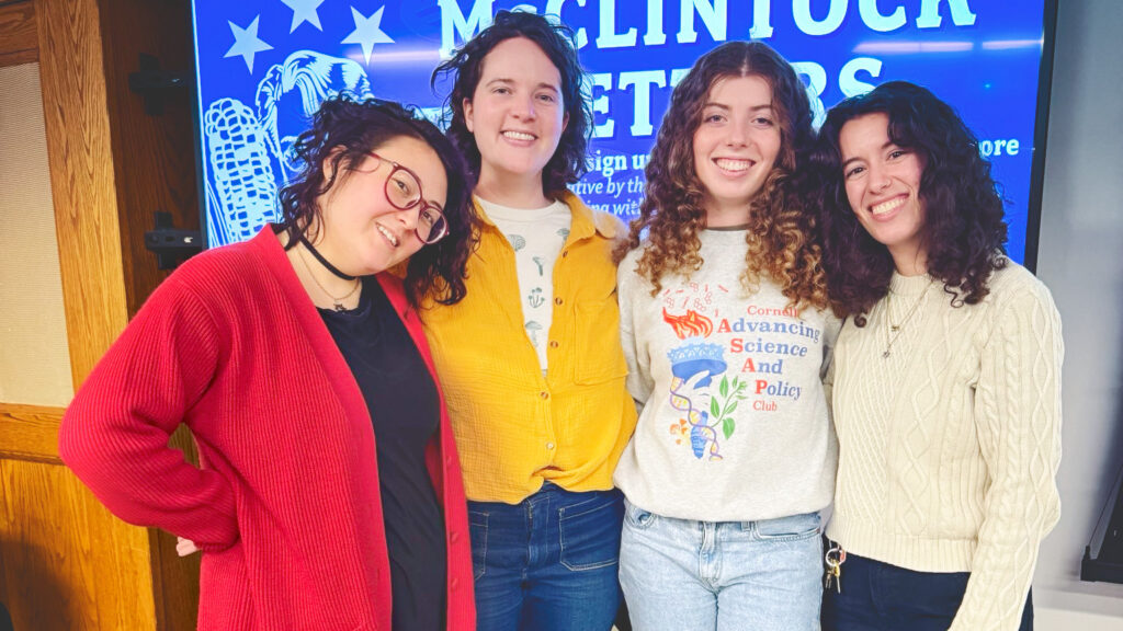 Hannah Frank and three fellow graduate students pose at a project event