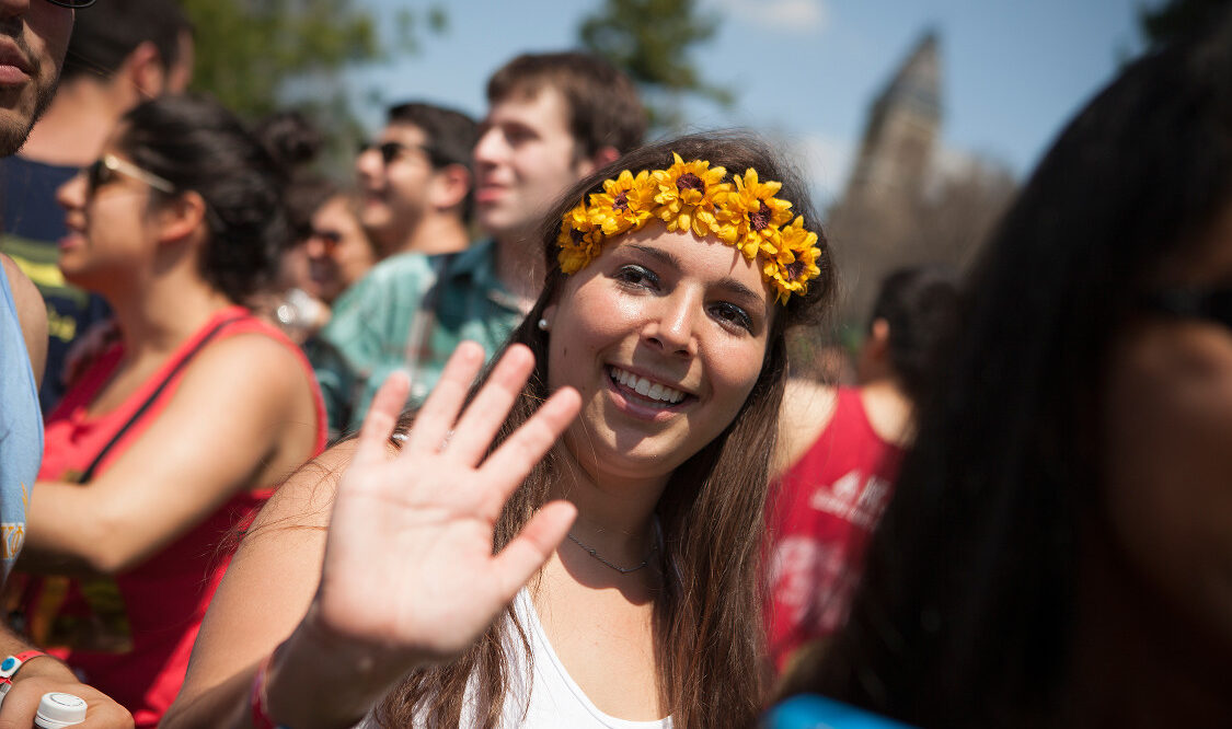 a woman wearing a crown of flowers at Slope Day