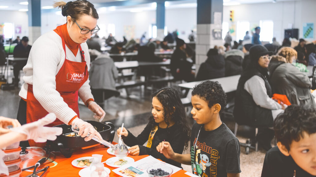 CCE SNAP Ed educators and give a food demonstration and share recipe cards and related nutrition information at West Hertel Academy in Buffalo New York