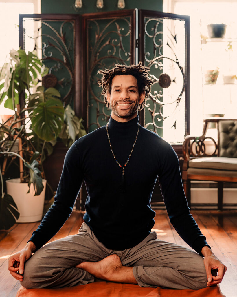 Kevin Gibson doing a seated yoga pose