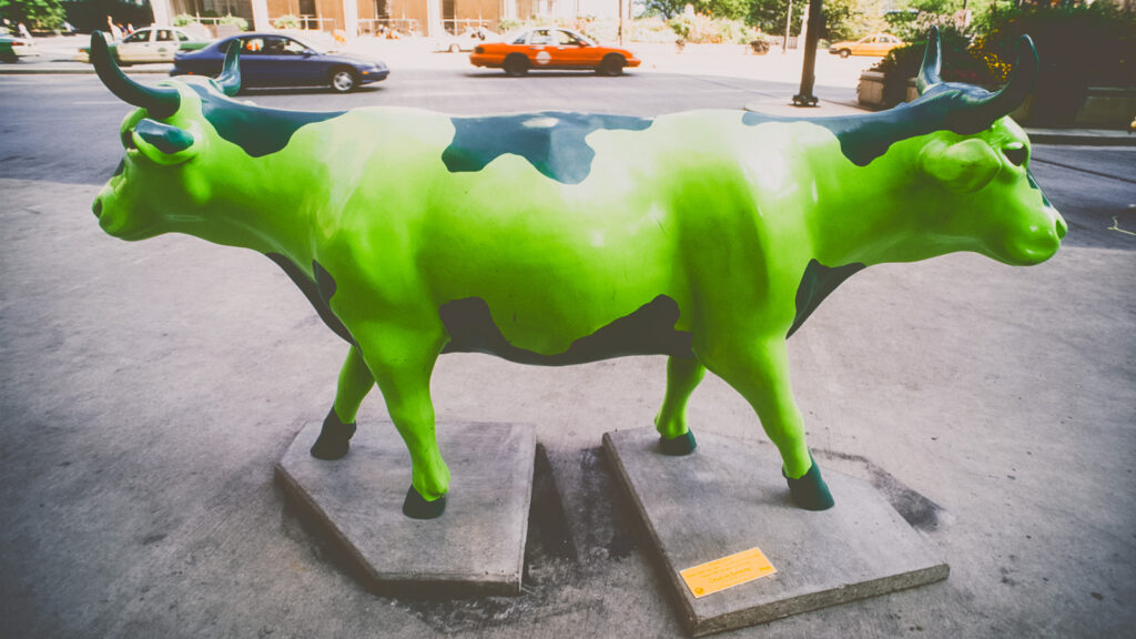 A two-headed green fiberglass cow