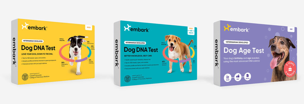 Three of the Embark dog tests in their boxes, featuring a dog on the front of each.