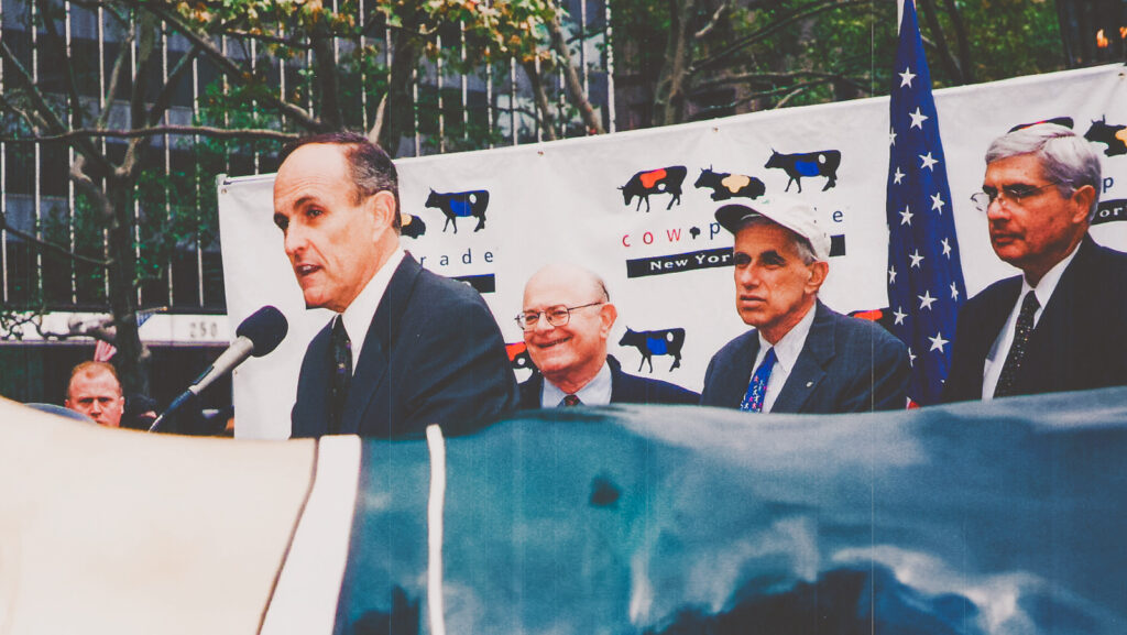 Mayor Rudy Giuliani leading a press conference; Jerry Elbaum is in the background