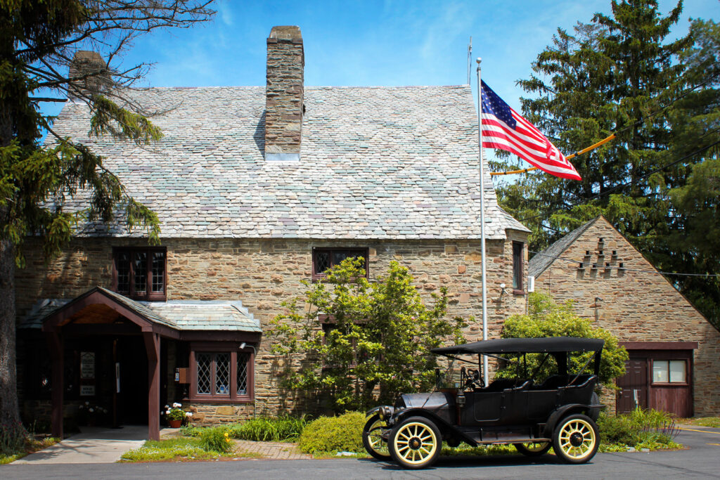 Cayuga Heights village hall with a vintage car out front