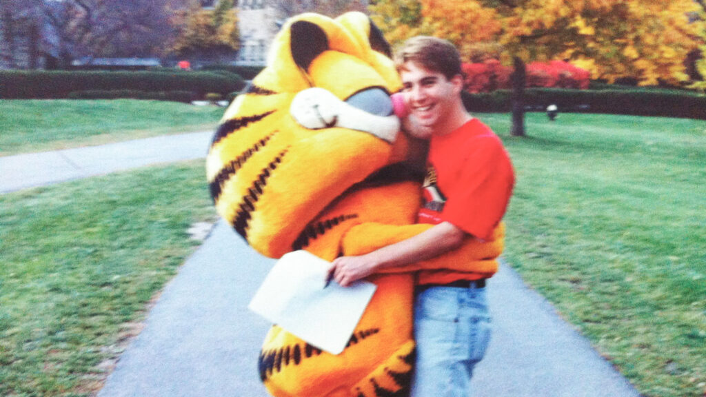 Matt Zucker on the Hill with Garfield during the world's largest lasagna on the quad.
