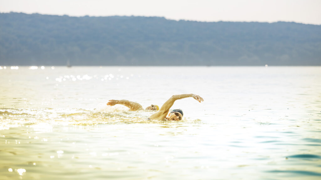 Claire De Boer, front, swims with Bridgette Hobart in Cayuga Lake.