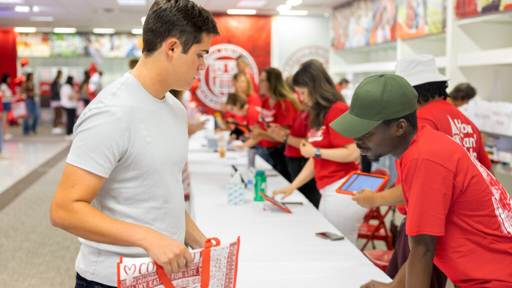 Students get their room keys from staff during Move-In Weekend, 2025