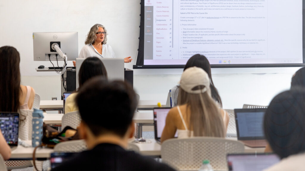 A teacher lectures in a classroom on the first day of classes, fall 2025