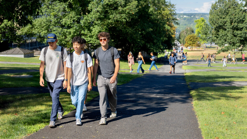 Students head up a path on the Arts Quad during the first day of classes, fall 2025
