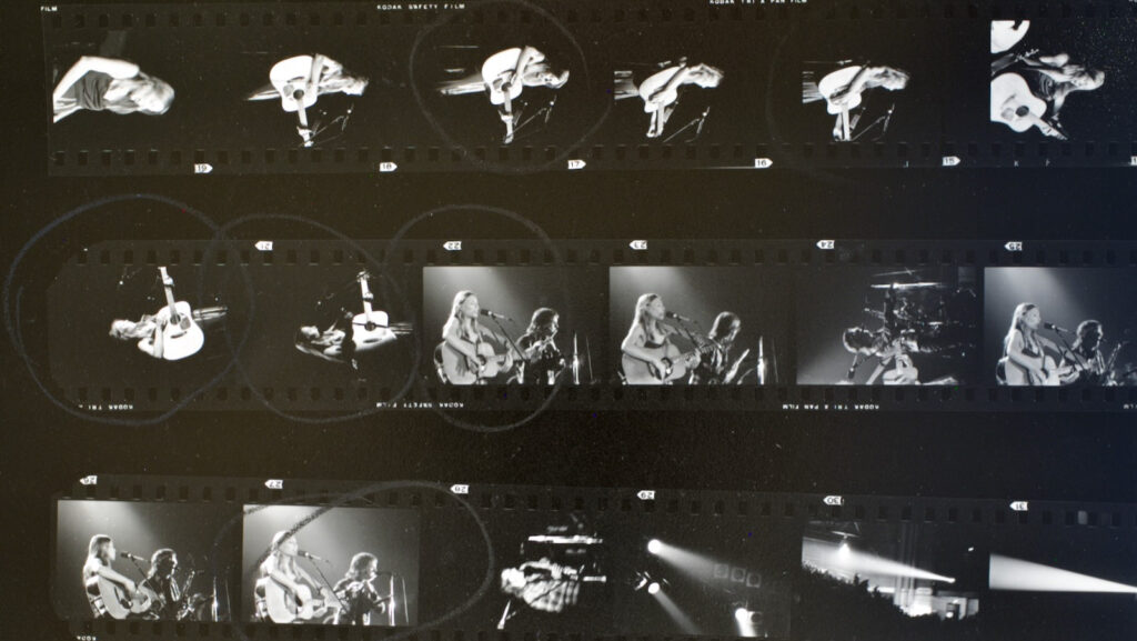 section of a contact sheet showing 35mm negatives of the February 1974 Joni Mitchell concert in Barton Hall