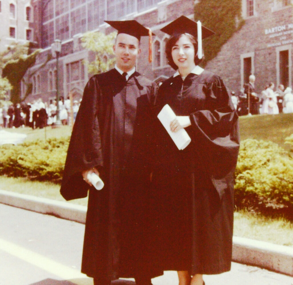 Howard and Ellen Reitkopp in caps and gowns on their graduation day