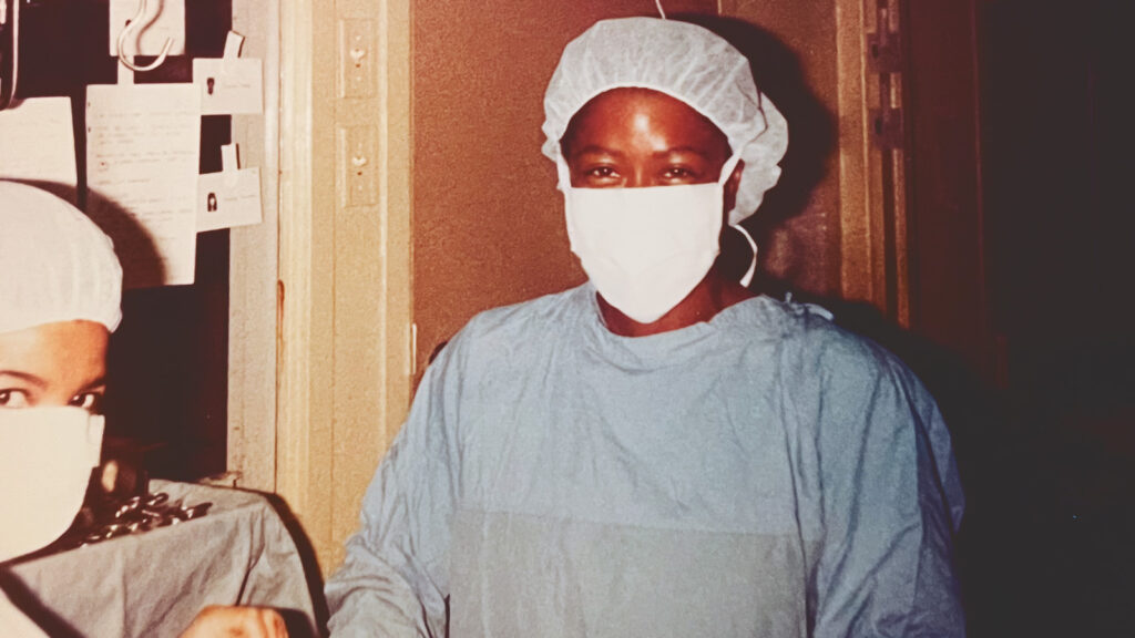Daphne Mobley in a hair net and mask as a student.