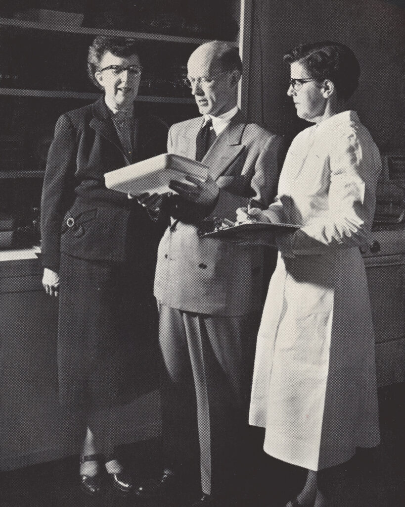 Lucy Maltby at left with two other Corning officials in 1954