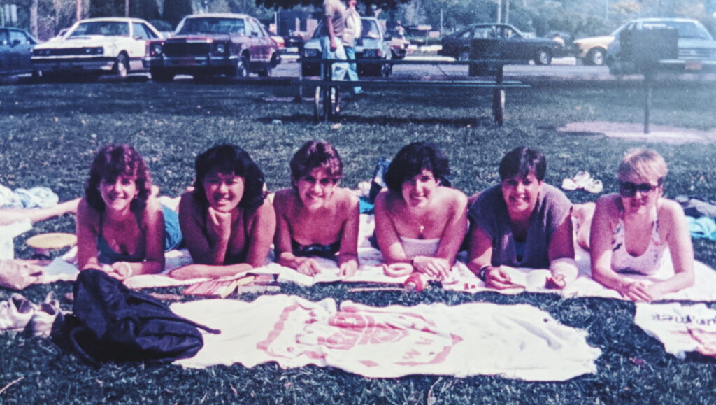 Melissa Reitkopp and five friends lying on the grass at Stewart Park in 1985