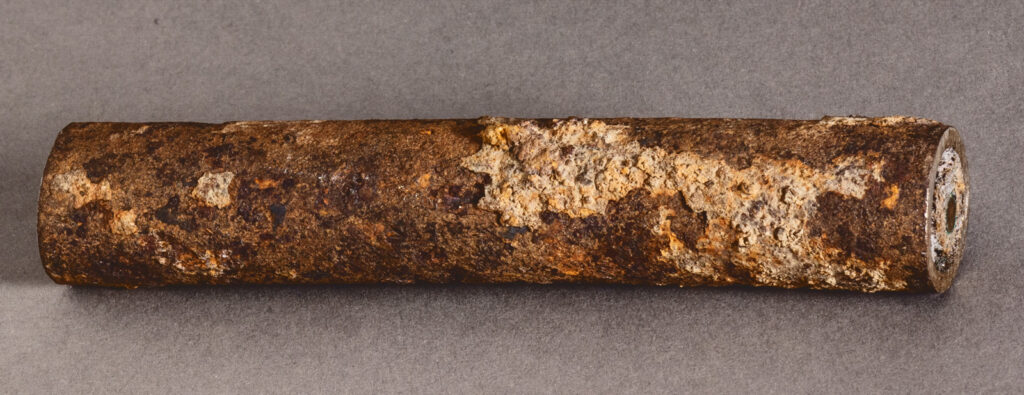 this segment of the original underground electric cable that powered the first outdoor arc lights on campus is now in the University archives