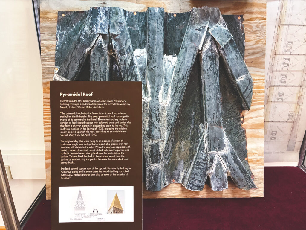 a section of the replaced 1930s-era roof of McGraw Tower is on display in Uris Library's gallery level as part of an exhibit on the tower's renovations and history