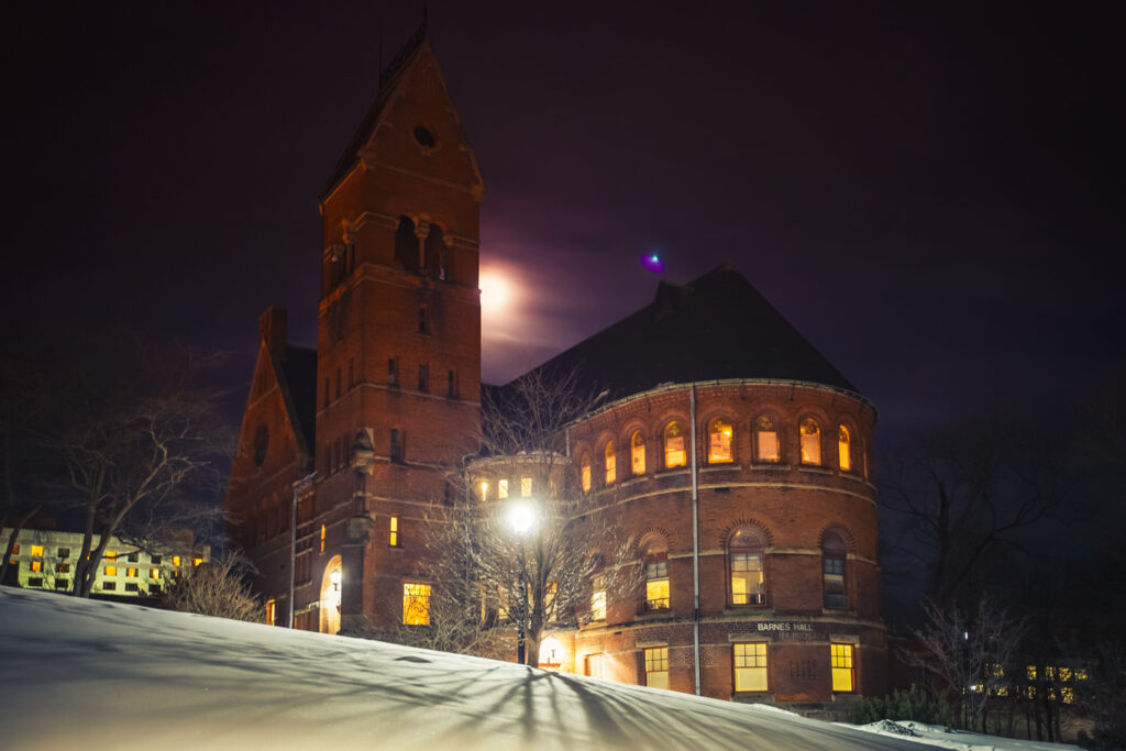 Barnes Hall, shown in a 2015 night view, was one of William H. Miller's first significant campus buildings