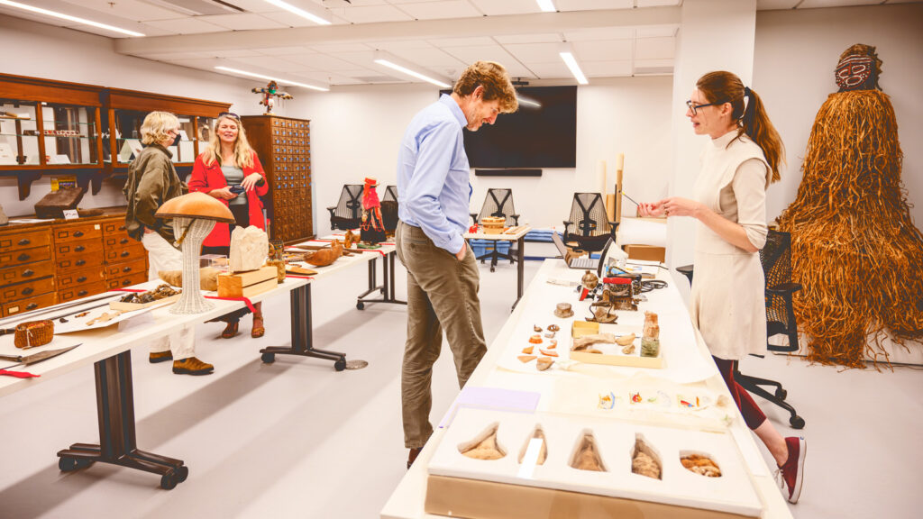 patrons visit an exhibit about the Anthropology Collaboratory in Olin Library during its grand reopening event in August; the collaborators houses several collections and groups formerly located in McGraw Hall, including the Anthropology and Cornell Institute of Archaeology & Material Studies (CIAMS)