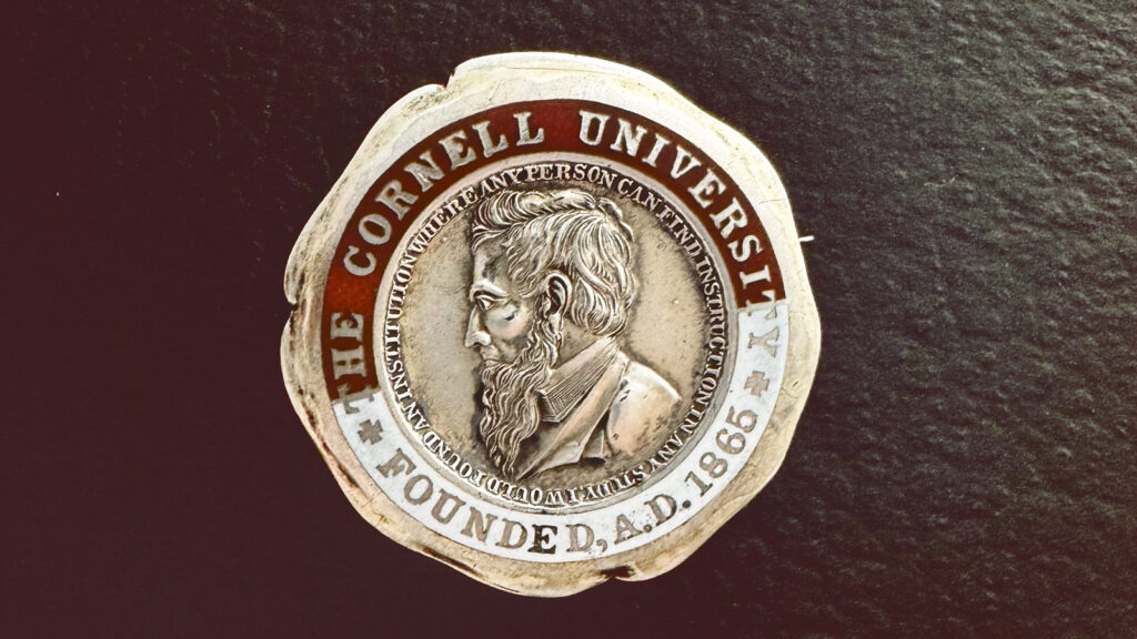 Ezra Cornell's profile within the University seal is shown on this vintage pin