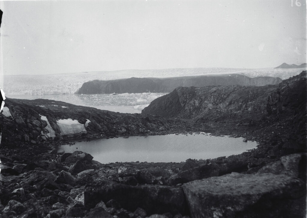 view of rock basin lakes in Greenland, circa 1896, with the Cornell Glacier and Mt. Schurman in the background