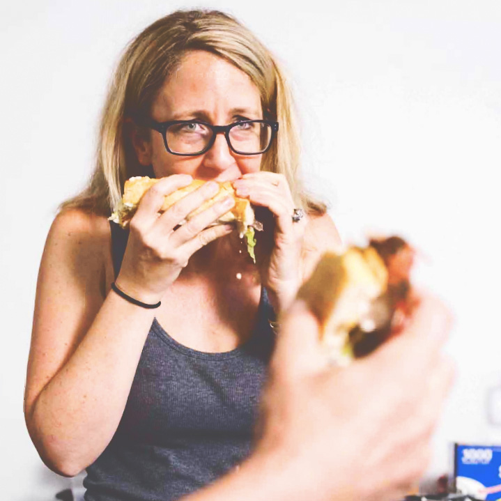 Laurie Woolever eating a po boy sandwich