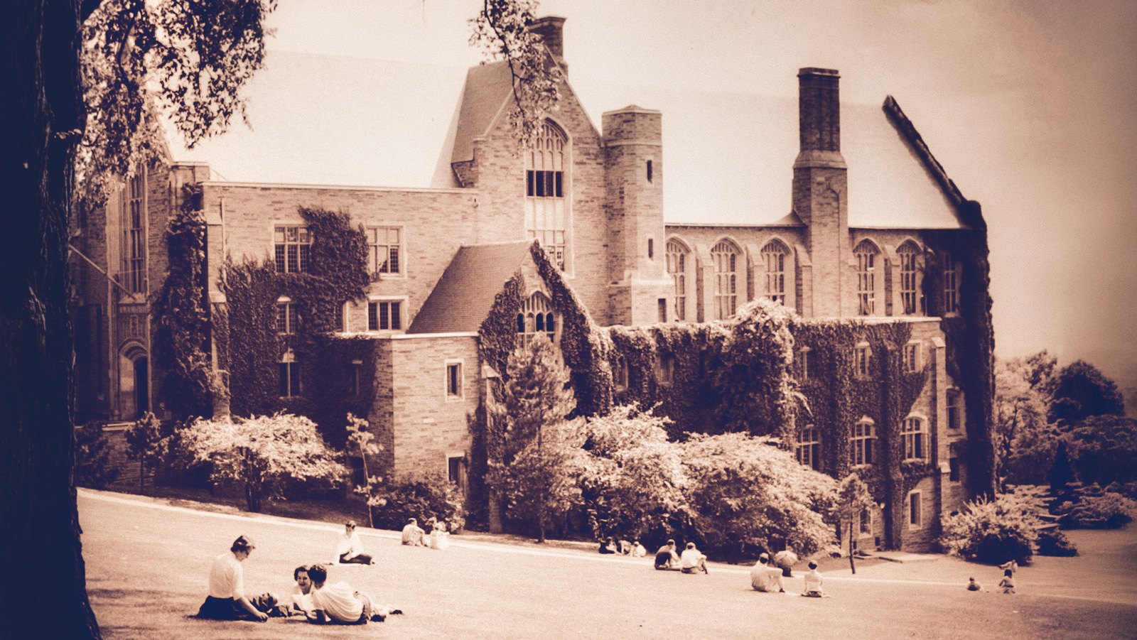 undated view of the Willard Straight Hall exterior and students on the Slope alongside it
