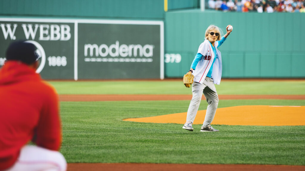 Claudia Goldin (pictured) photographed throwing the first pitch at Fenway Park.